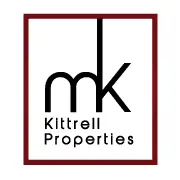 Logo of Kittrell Properties featuring the initials "mk" in lowercase black letters, framed by a thin maroon border with the company name written below the initials.
